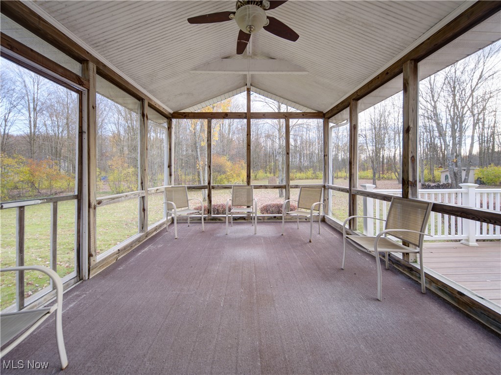 17161 Burrows Road Thompson, OH 44086 - Photo 14 of 48 Unfurnished sunroom featuring ceiling fan, a healthy amount of sunlight, and vaulted ceiling