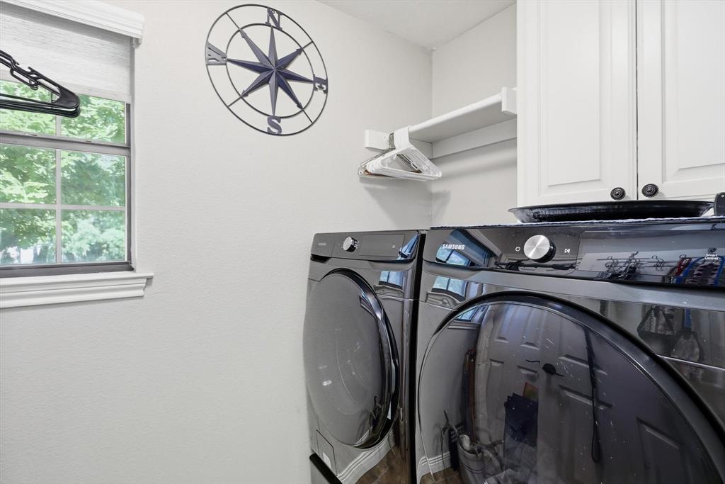 6000 Jackson Road Krum, TX 76249 - Photo 19 of 40 a utility room with multiple dryer and washer