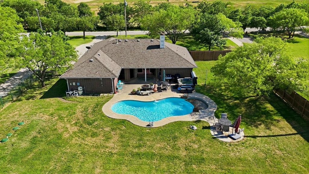 6000 Jackson Road Krum, TX 76249 - Photo 21 of 40 a aerial view of a house with swimming pool and garden