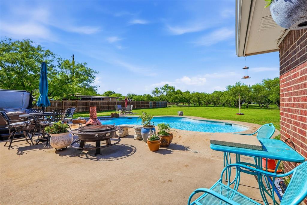 6000 Jackson Road Krum, TX 76249 - Photo 22 of 40 a backyard of a house with outdoor seating