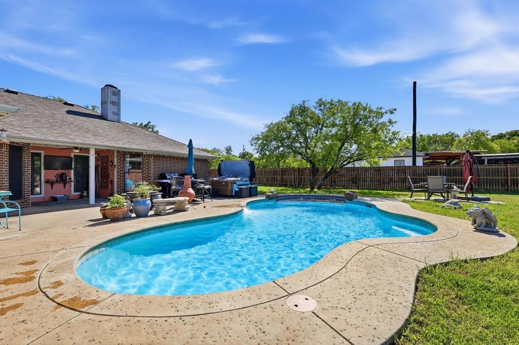 6000 Jackson Road Krum, TX 76249 - Photo 23 of 40 a view of a house with swimming pool and sitting area