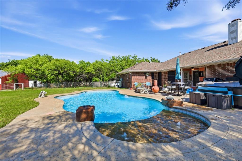 6000 Jackson Road Krum, TX 76249 - Photo 25 of 40 a view of a house with swimming pool and sitting area