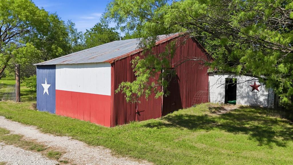 6000 Jackson Road Krum, TX 76249 - Photo 27 of 40 a view of a house with a yard