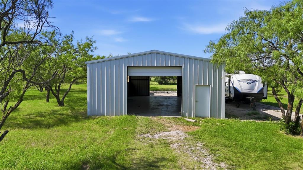 6000 Jackson Road Krum, TX 76249 - Photo 31 of 40 a front view of a house with a yard