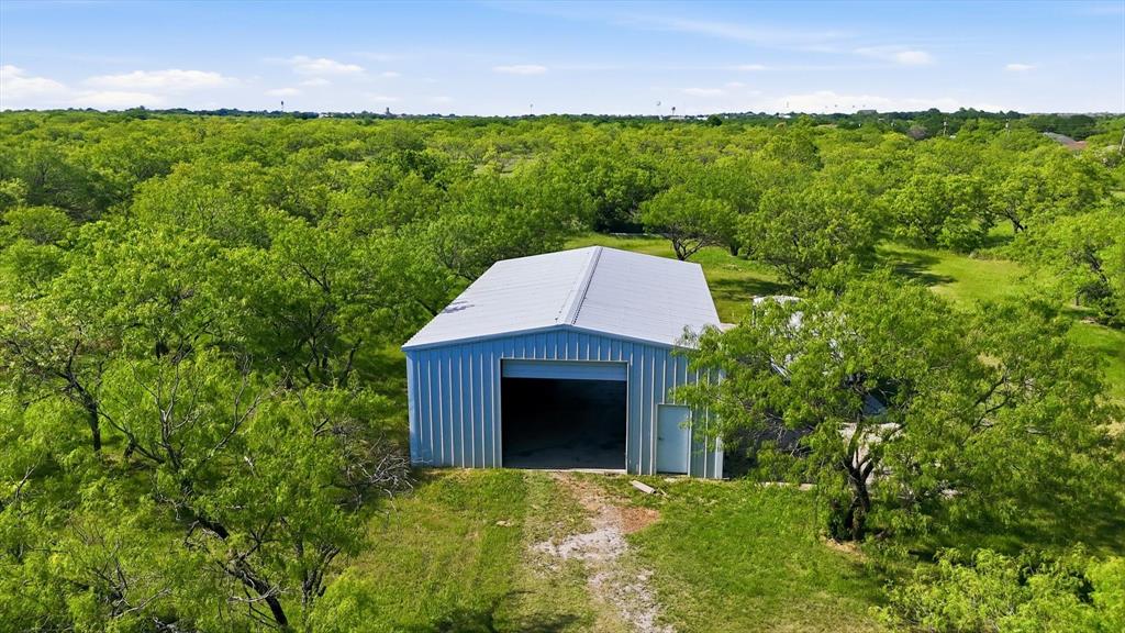 6000 Jackson Road Krum, TX 76249 - Photo 32 of 40 a backyard of a house with lots of green space and mountain view
