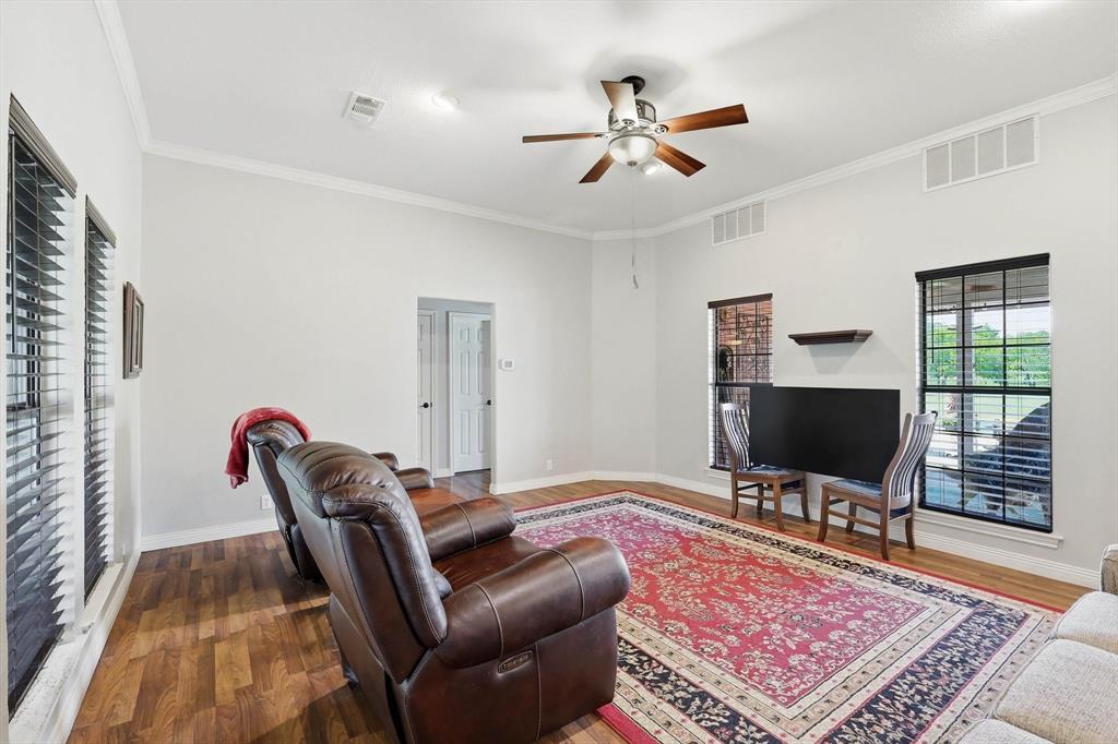 6000 Jackson Road Krum, TX 76249 - Photo 5 of 40 a living room with furniture rug and a flat screen tv