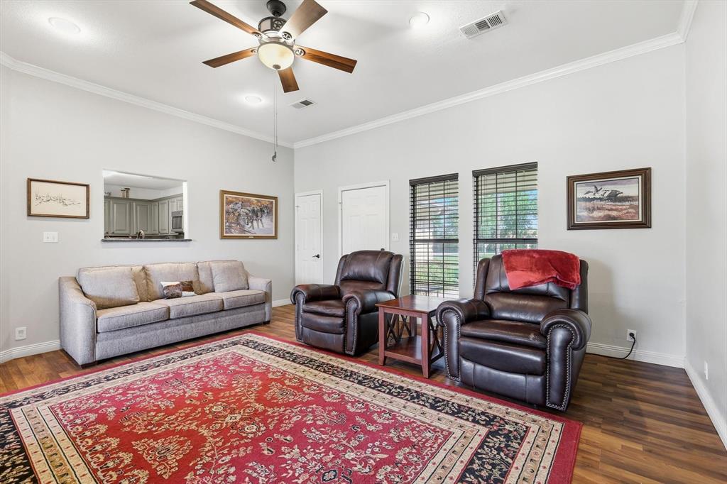 6000 Jackson Road Krum, TX 76249 - Photo 6 of 40 a living room with furniture and a rug