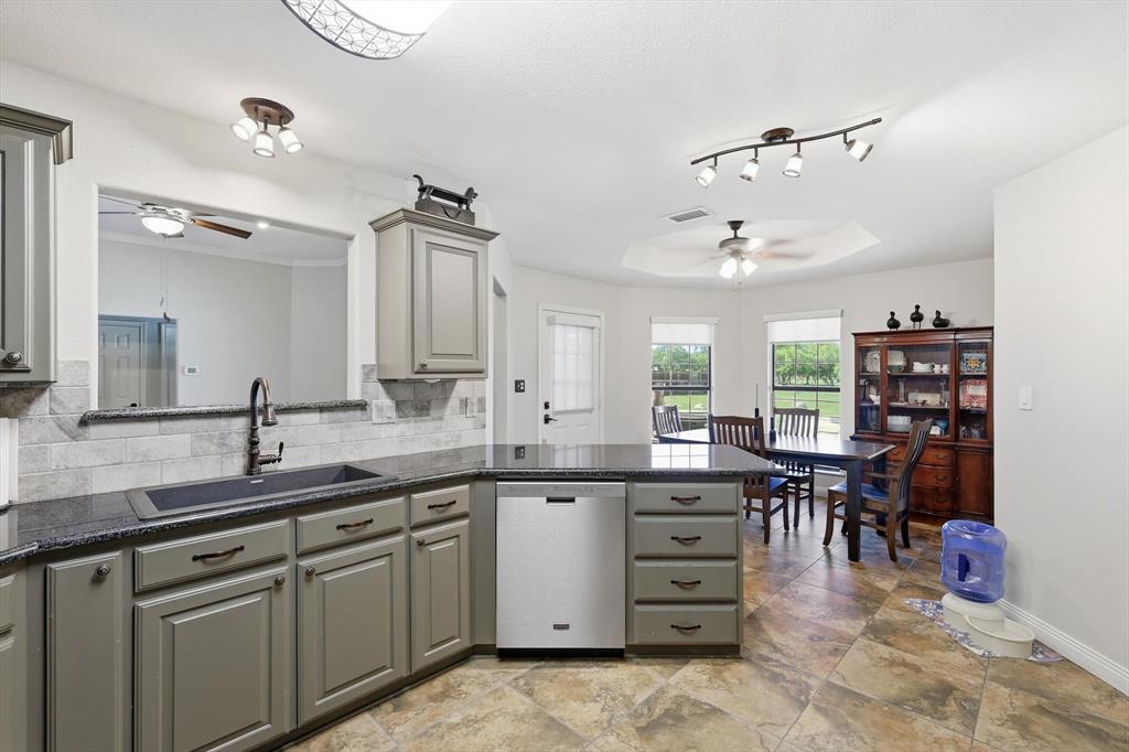 6000 Jackson Road Krum, TX 76249 - Photo 10 of 40 a kitchen with a sink and cabinets