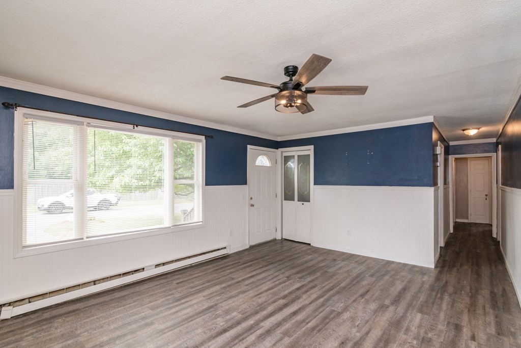 160 Vincent Street Springfield, MA 01129 - Photo 3 of 26 a view of empty room with wooden floor and fan
