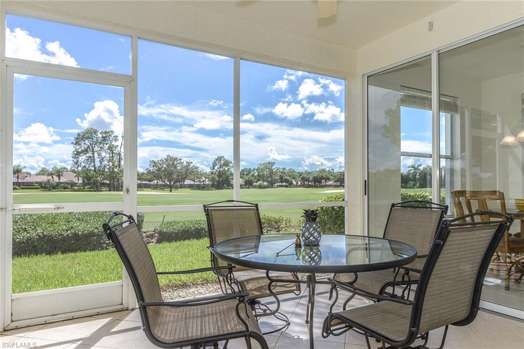 23770 Clear Spring Court, Unit 1402 Estero, FL 34135 - Photo 14 of 17 a view of a living room and floor to ceiling window