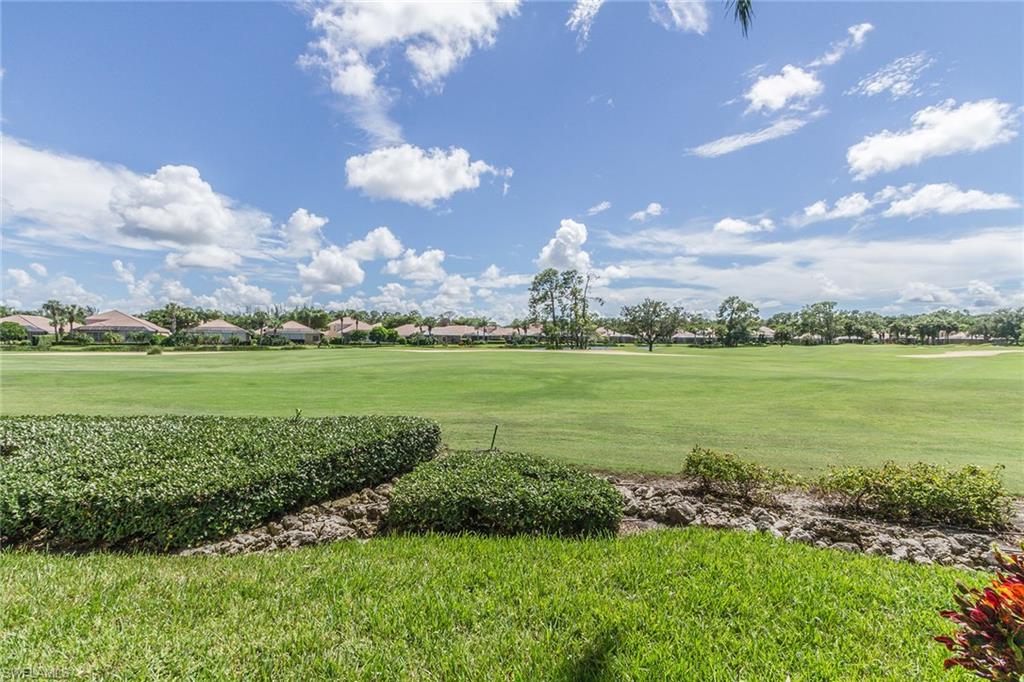 23770 Clear Spring Court, Unit 1402 Estero, FL 34135 - Photo 15 of 17 a view of a lake with a big yard