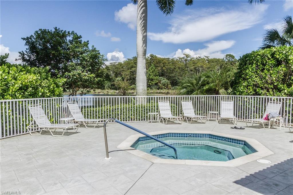 23770 Clear Spring Court, Unit 1402 Estero, FL 34135 - Photo 17 of 17 a view of a chair and tables in the roof deck