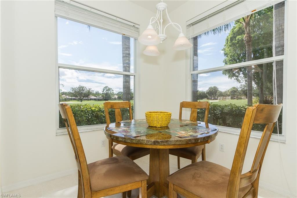 23770 Clear Spring Court, Unit 1402 Estero, FL 34135 - Photo 5 of 17 a view of a dining room with furniture window and outside view