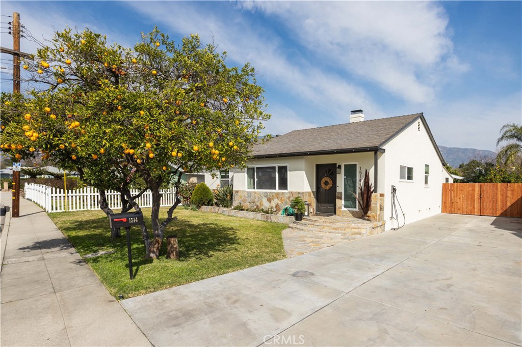 1514 Pilgrim Way Monrovia, CA 91016 - Photo 1 of 47 a view of a house with backyard sitting area and garden