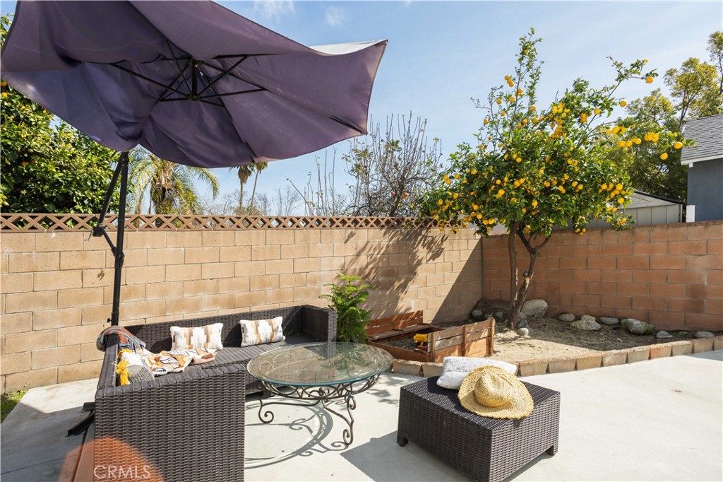 1514 Pilgrim Way Monrovia, CA 91016 - Photo 36 of 47 a view of a backyard with table and chairs under an umbrella