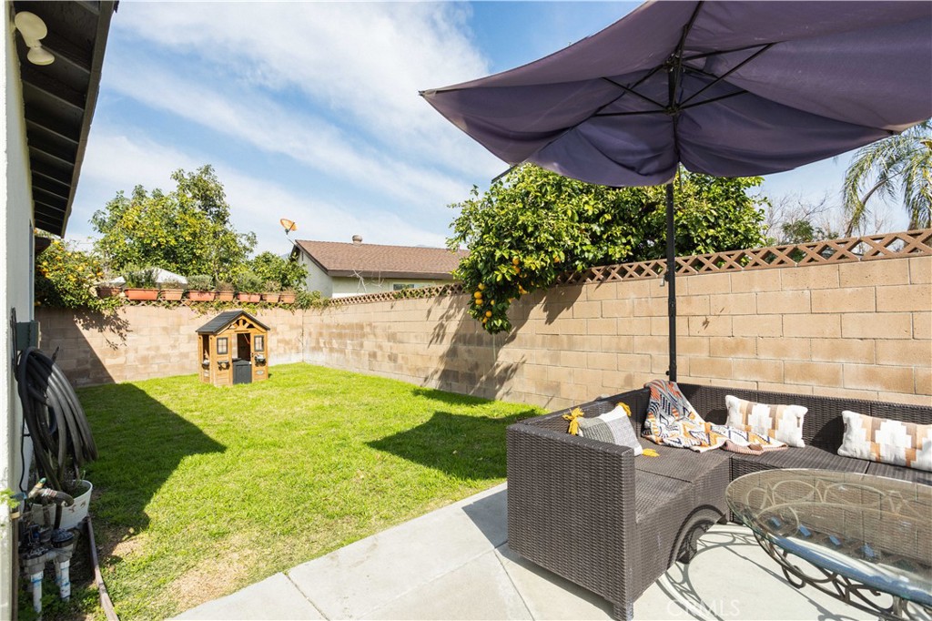 1514 Pilgrim Way Monrovia, CA 91016 - Photo 37 of 47 a view of a backyard with table and chairs under an umbrella