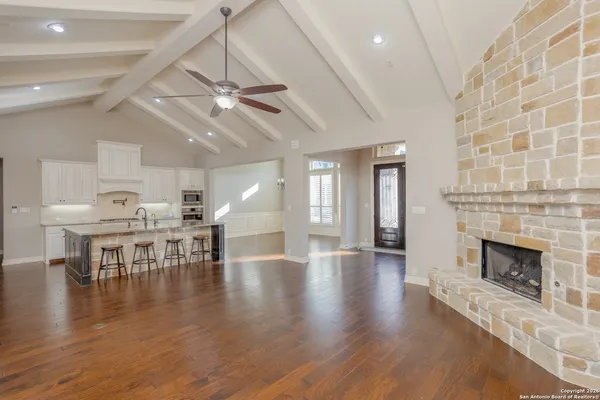 a view of a livingroom with furniture and a fireplace