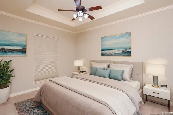 a bedroom with a bed and a painting on the wall