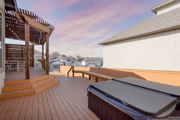 a terrace with outdoor seating and city view