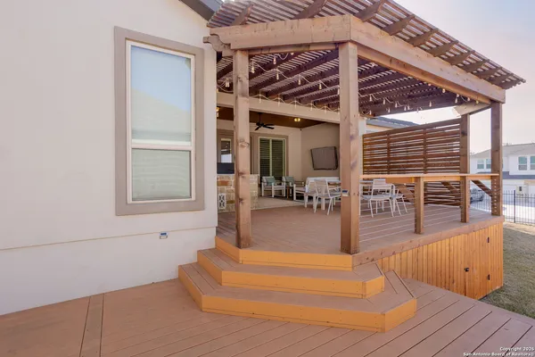 a view of a living room and livingroom with wooden floor