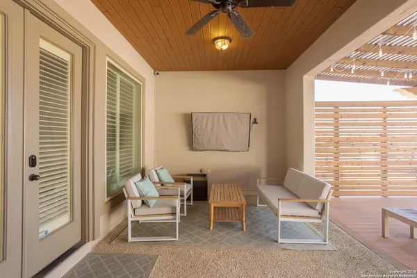a living room with furniture and a window