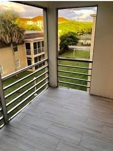 2700 Riverside Drive, Unit 302B Coral Springs, FL 33065 - Photo 2 of 7 a view of a two room with wooden floor and windows