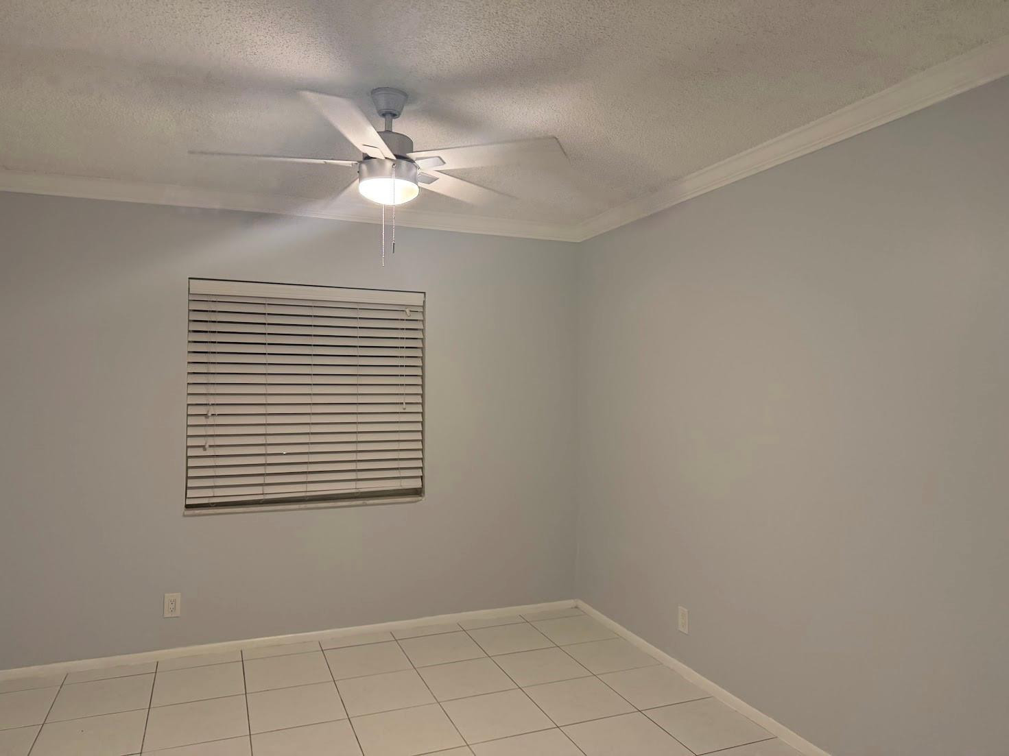 2700 Riverside Drive, Unit 302B Coral Springs, FL 33065 - Photo 4 of 7 a view of an empty room with a window