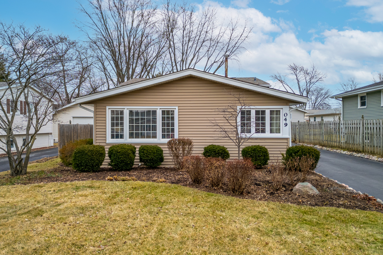N049 Page Street Winfield, IL 60190 - Photo 2 of 31 a front view of a house with a yard and outdoor seating