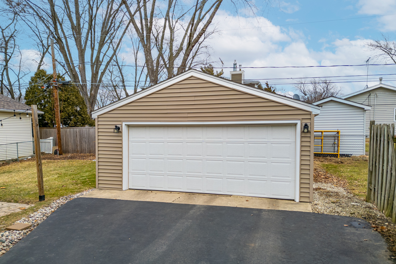 N049 Page Street Winfield, IL 60190 - Photo 23 of 31 a front view of a house with a garage