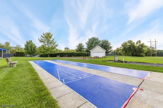 a view of a city with lush green forest