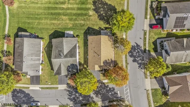 an aerial view of a house with a swimming pool