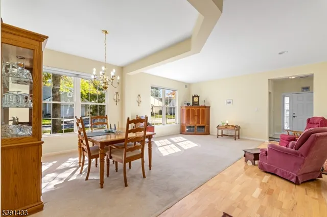 a view of a livingroom with furniture and chandelier
