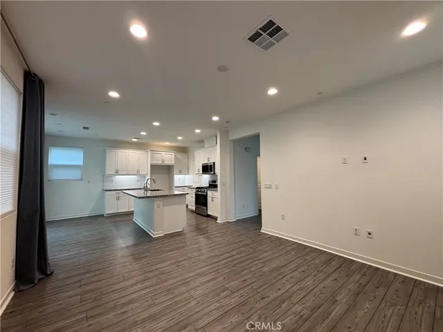a view of a kitchen and dining room