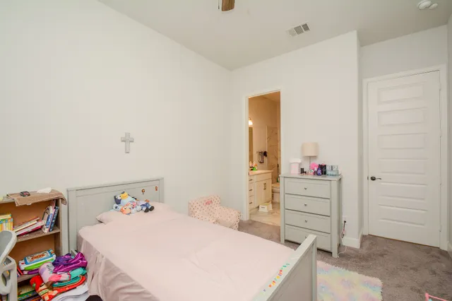 a bedroom with a bed and closet