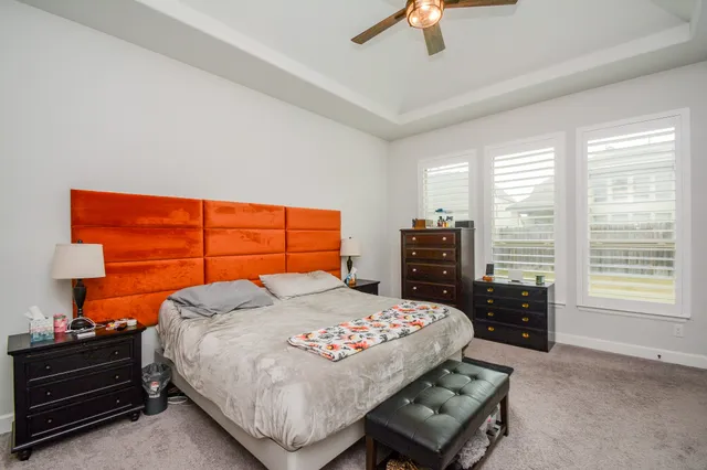 a bedroom with a bed and a tv