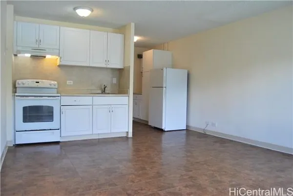 a view of a kitchen with electric appliances