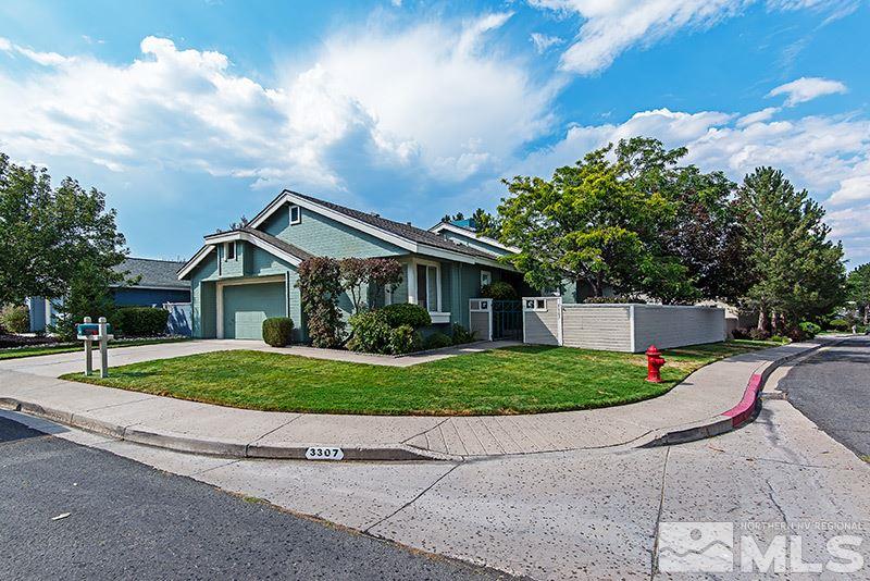 3307 Current Court Reno, NV 89509 - Photo 1 of 19 a front view of a house with a yard and garage