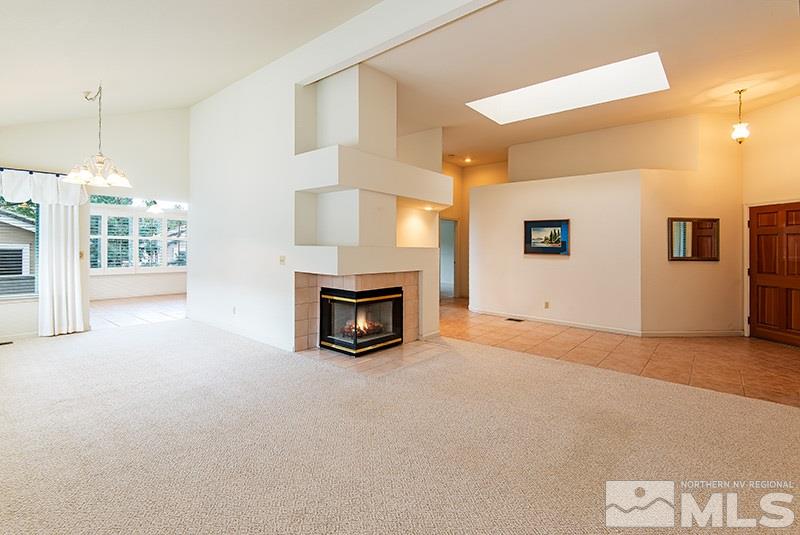 3307 Current Court Reno, NV 89509 - Photo 3 of 19 a view of an empty room with a fireplace and a window