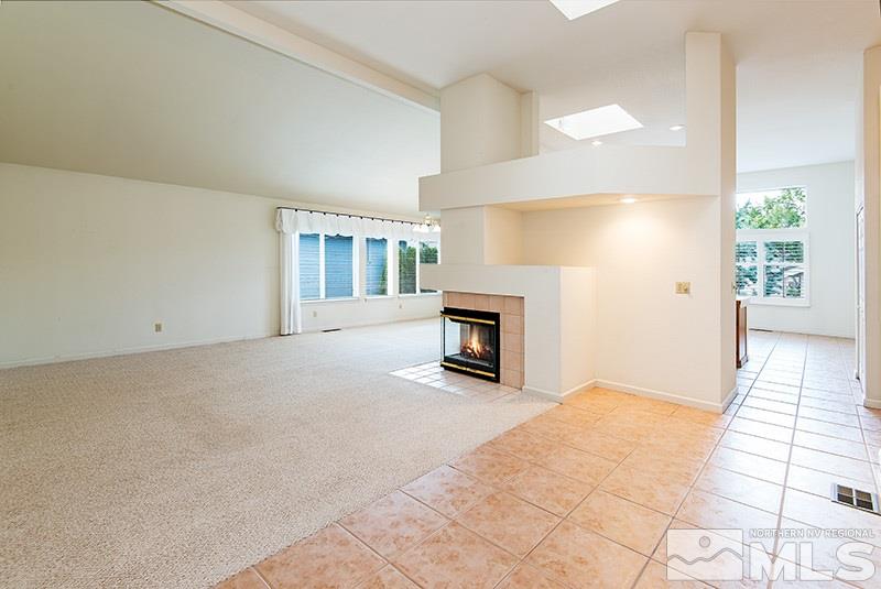 3307 Current Court Reno, NV 89509 - Photo 4 of 19 a view of an empty room with a fireplace and a window