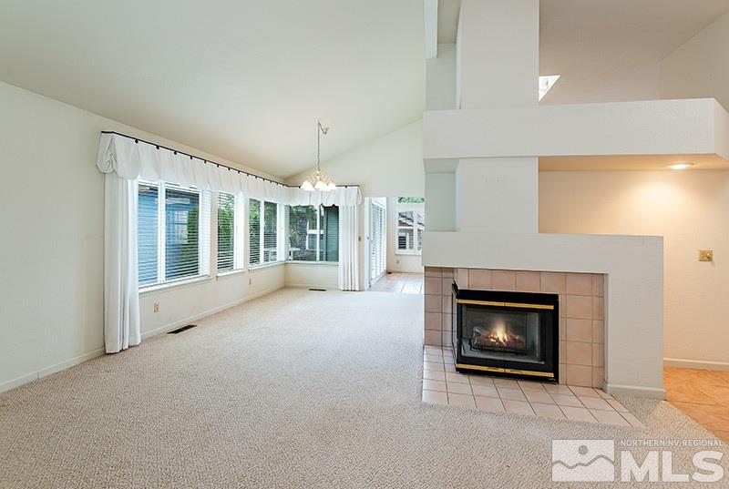 3307 Current Court Reno, NV 89509 - Photo 5 of 19 a view of an empty room with a fireplace and a window