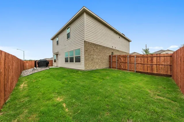 a view of backyard with green space