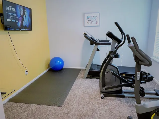 a view of a room with gym equipment