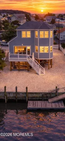 a view of a lake with a house in the background