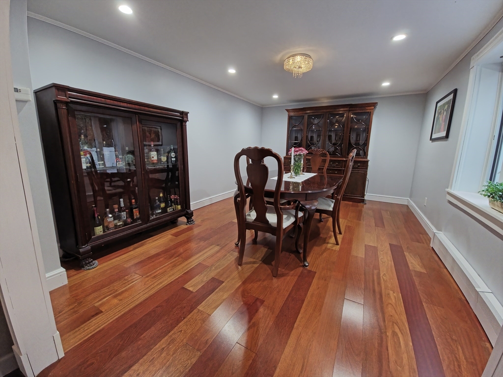 9 Venner Road Arlington, MA 02476 - Photo 11 of 40 a dining room with furniture and wooden floor