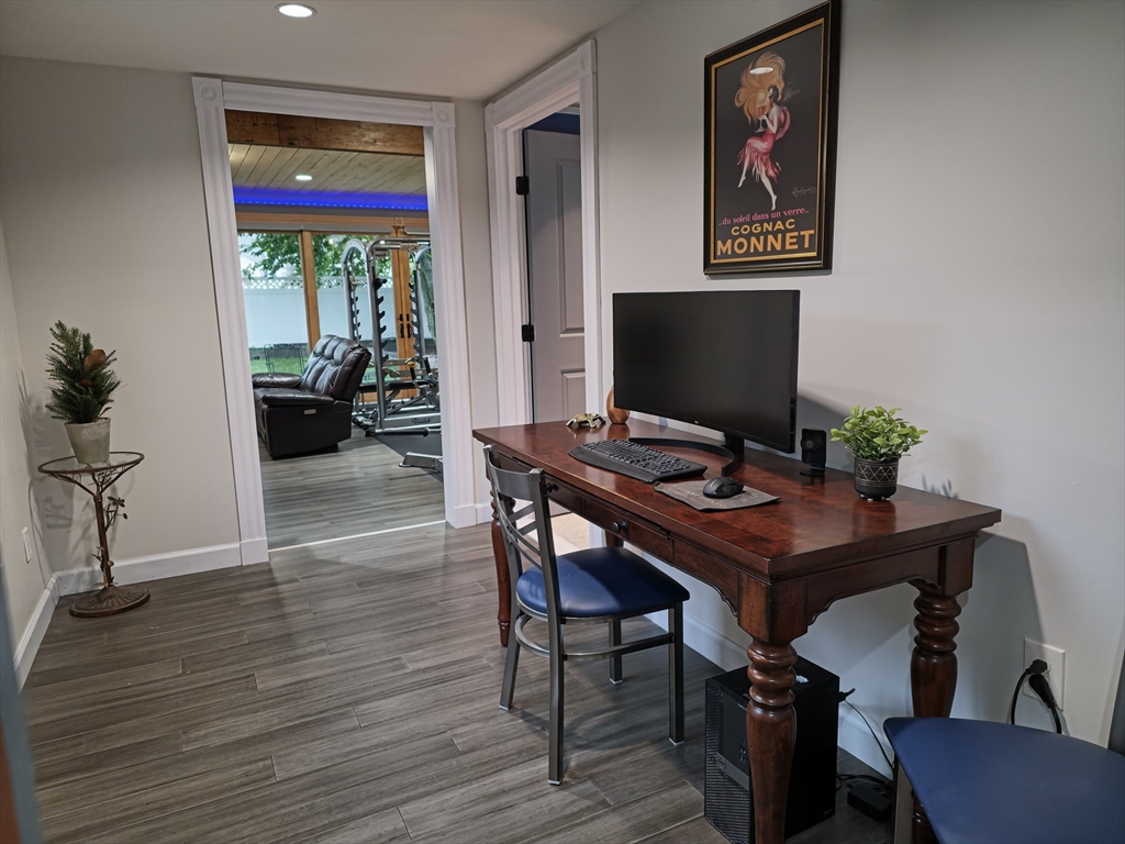 9 Venner Road Arlington, MA 02476 - Photo 12 of 40 a view of a workspace with furniture window and wooden floor