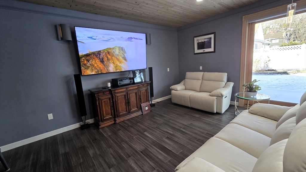 9 Venner Road Arlington, MA 02476 - Photo 15 of 40 a living room with furniture and a flat screen tv