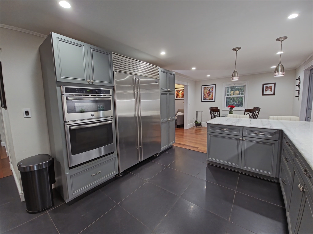 9 Venner Road Arlington, MA 02476 - Photo 5 of 40 a kitchen with stainless steel appliances a refrigerator sink and microwave