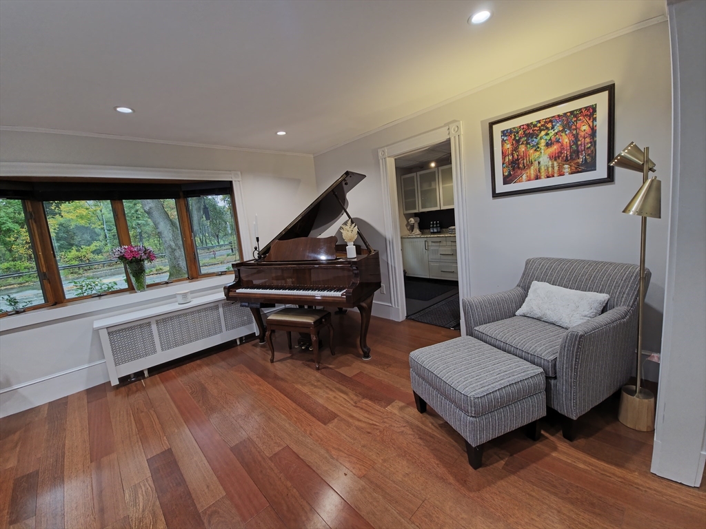 9 Venner Road Arlington, MA 02476 - Photo 9 of 40 a living room with furniture and a wooden floor