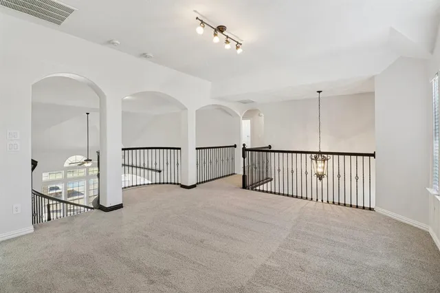 a view of an empty room with windows