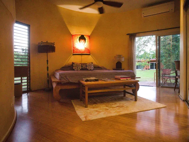 a room with pool table and glass windows